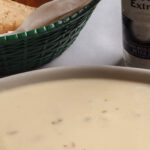 melted cheese in a plate tortillas chips on the side