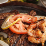 Arracheras, beef skirt fillet, shrimps, tomato bell peppers and onions