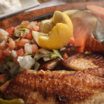 grilled fish lemon pico de gallo rice steam coming out