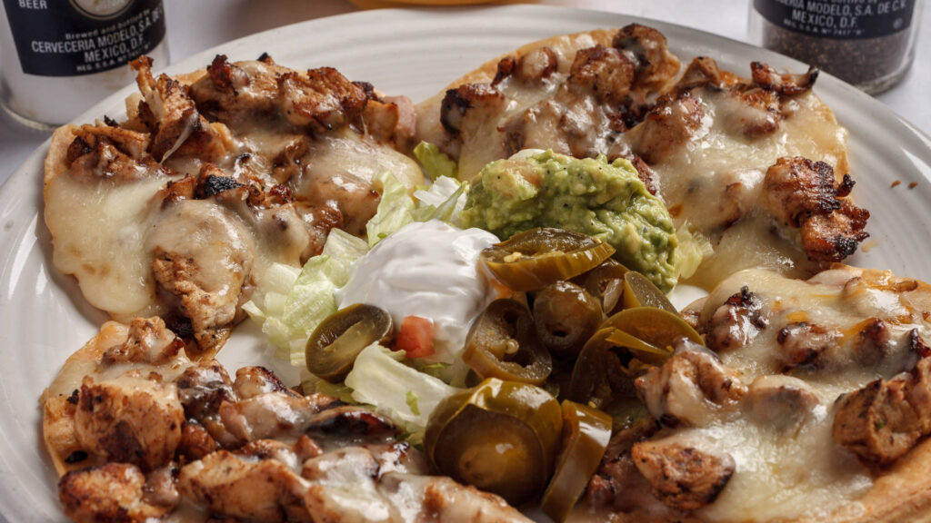 nachos gilled chicken pico de gallo guacamole chopped jalapenos sour cream