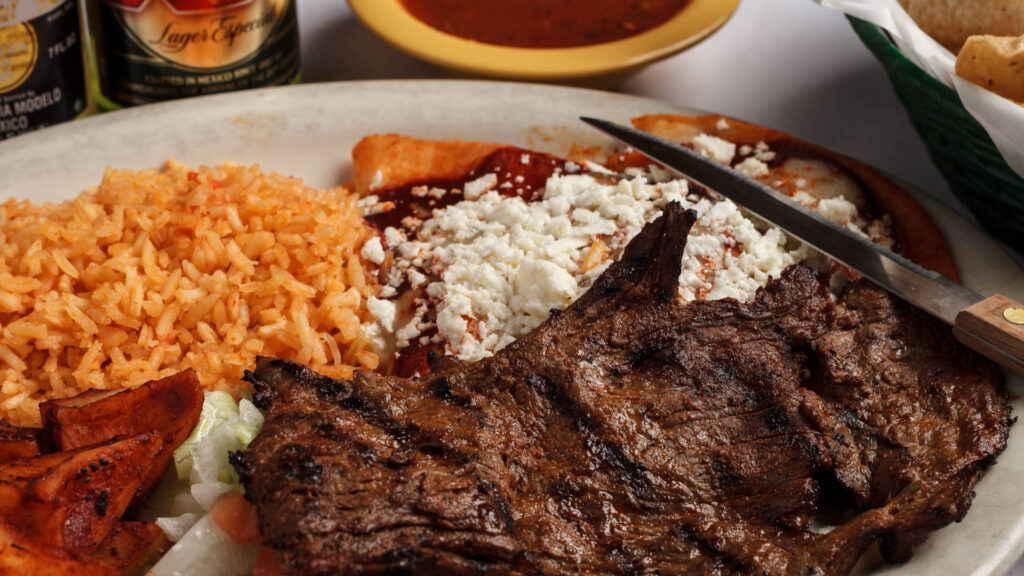 arrechera meat rice enchiladas cheese on top