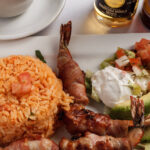 shrimp wrapped in bacon rice sour cream and pico de gallo