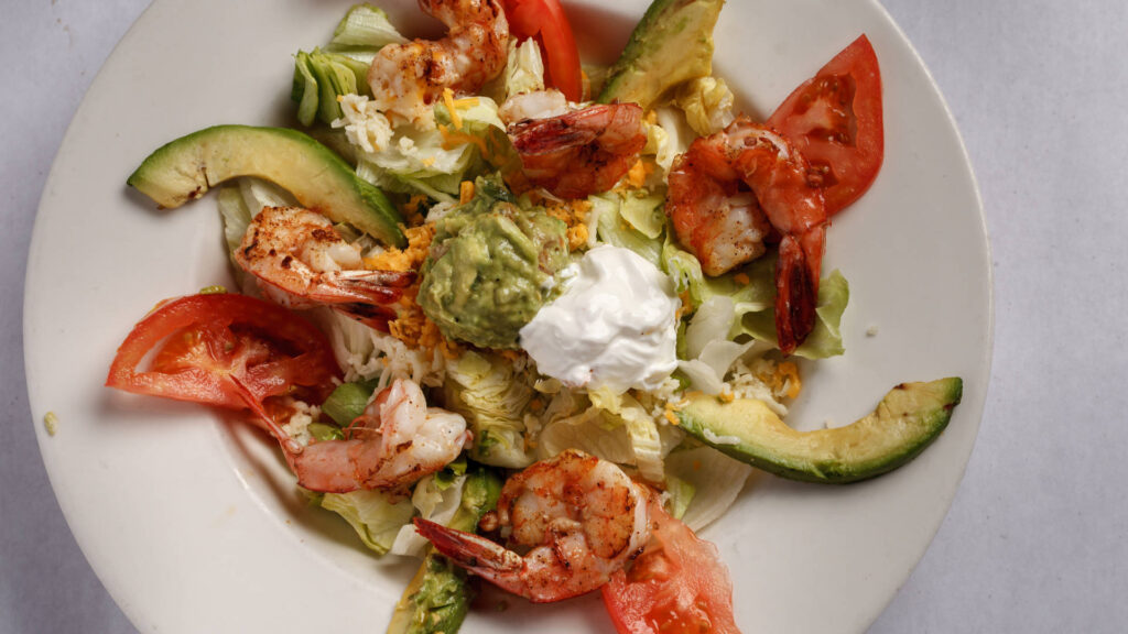 shrimps sliced avocado tomatoes guacamole lettuce cheese sour cream
