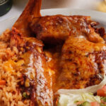 tamales rice refried beans pico de gallo sauce and melted cheese on top